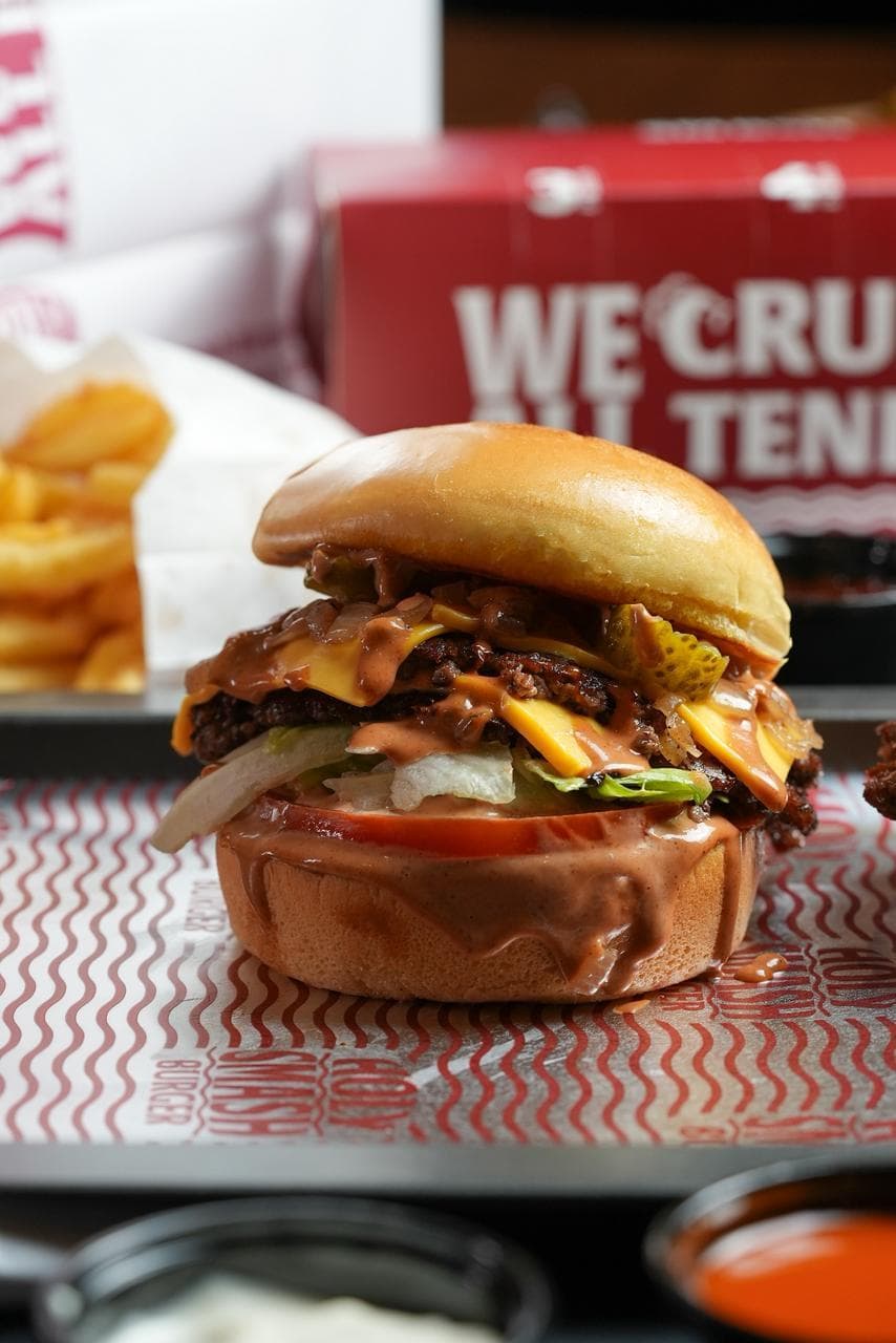 Double smash burger with tomato, onion, lettuce and smash sauce